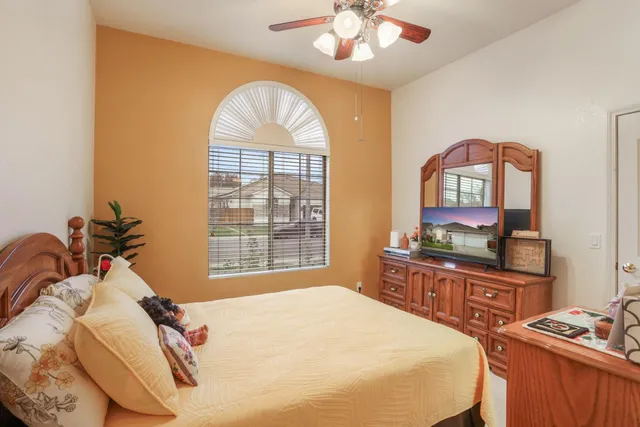 a view of a livingroom with furniture and floor to ceiling window