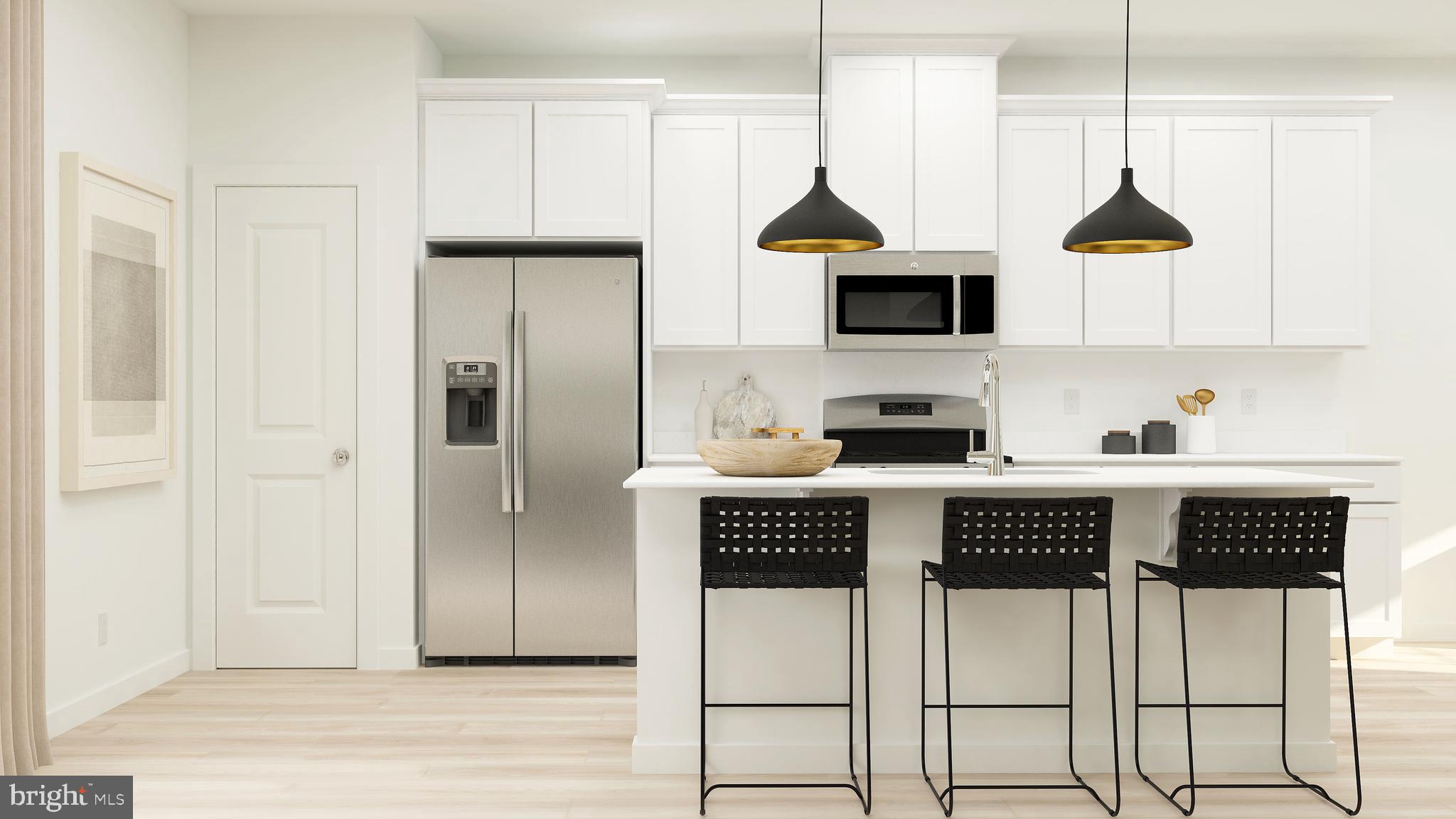 a kitchen with stainless steel appliances granite countertop a refrigerator a stove a microwave oven a sink and dishwasher