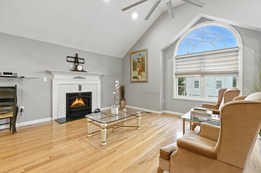 13 Colonial Drive Clinton, MA 01510 - Photo 14 of 42 a living room with furniture and a fireplace