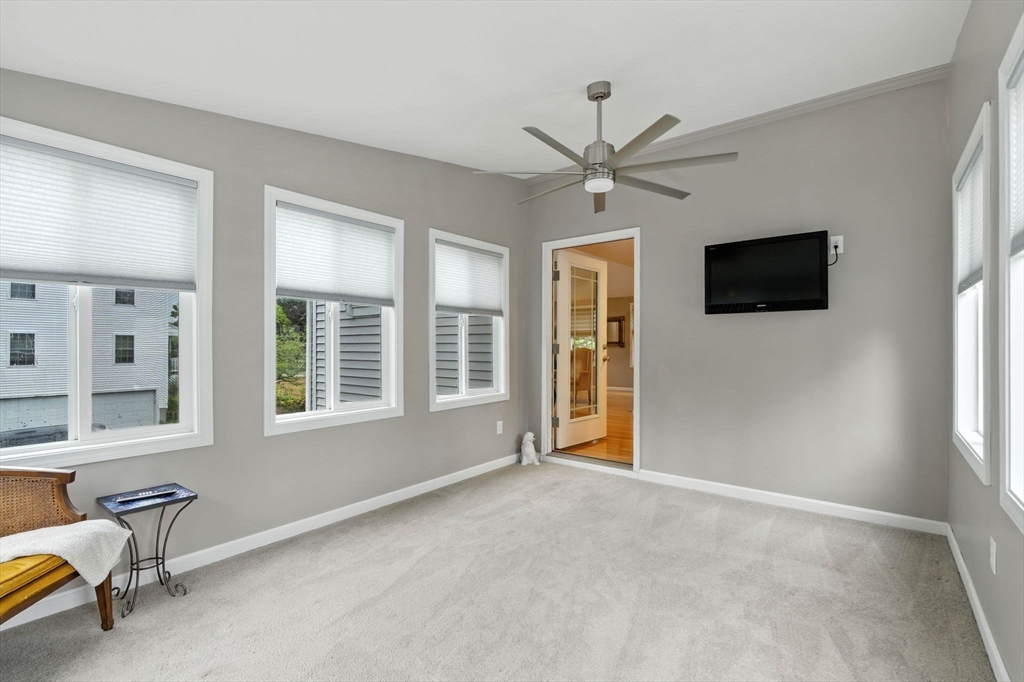 13 Colonial Drive Clinton, MA 01510 - Photo 15 of 42 a view of an empty room with a window and a flat screen tv