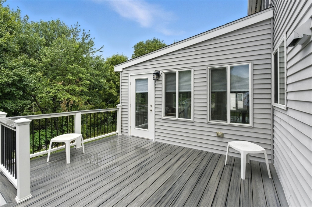 13 Colonial Drive Clinton, MA 01510 - Photo 17 of 42 a view of a house with a deck
