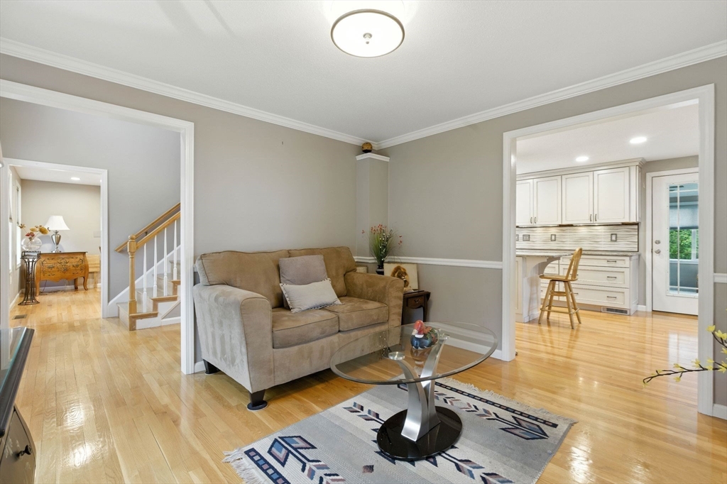 13 Colonial Drive Clinton, MA 01510 - Photo 18 of 42 a living room with furniture and a rug