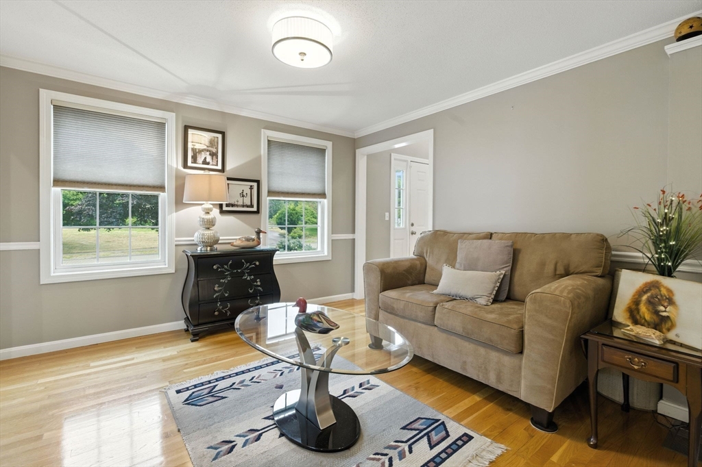 13 Colonial Drive Clinton, MA 01510 - Photo 19 of 42 a living room with furniture and a table