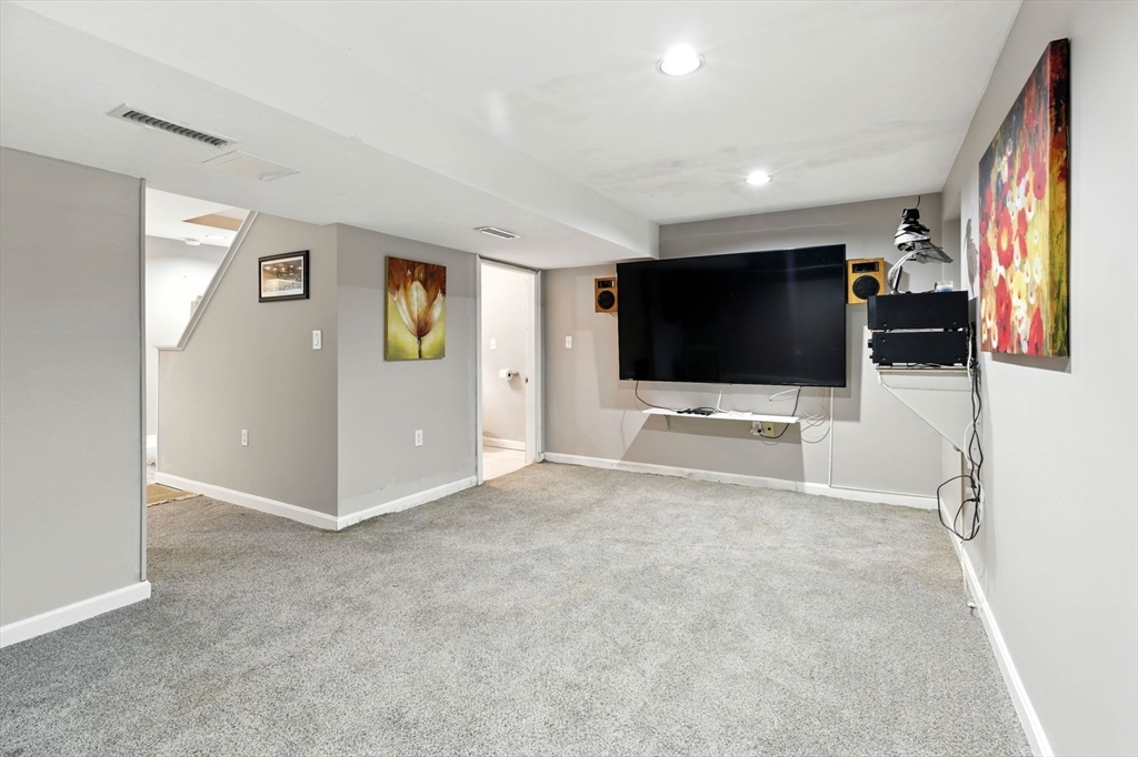 13 Colonial Drive Clinton, MA 01510 - Photo 31 of 42 a view of a livingroom with furniture and flat screen tv