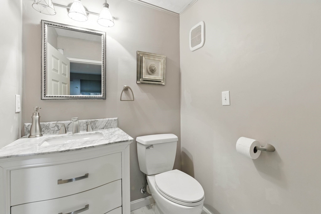 13 Colonial Drive Clinton, MA 01510 - Photo 32 of 42 a bathroom with a granite countertop toilet sink and mirror