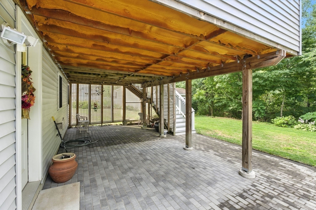 13 Colonial Drive Clinton, MA 01510 - Photo 35 of 42 a view of a porch with furniture and backyard