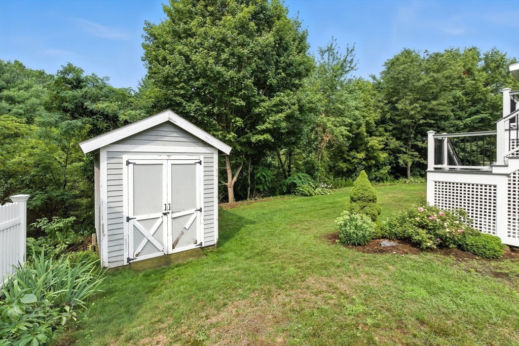 13 Colonial Drive Clinton, MA 01510 - Photo 37 of 42 a front view of a house with garden