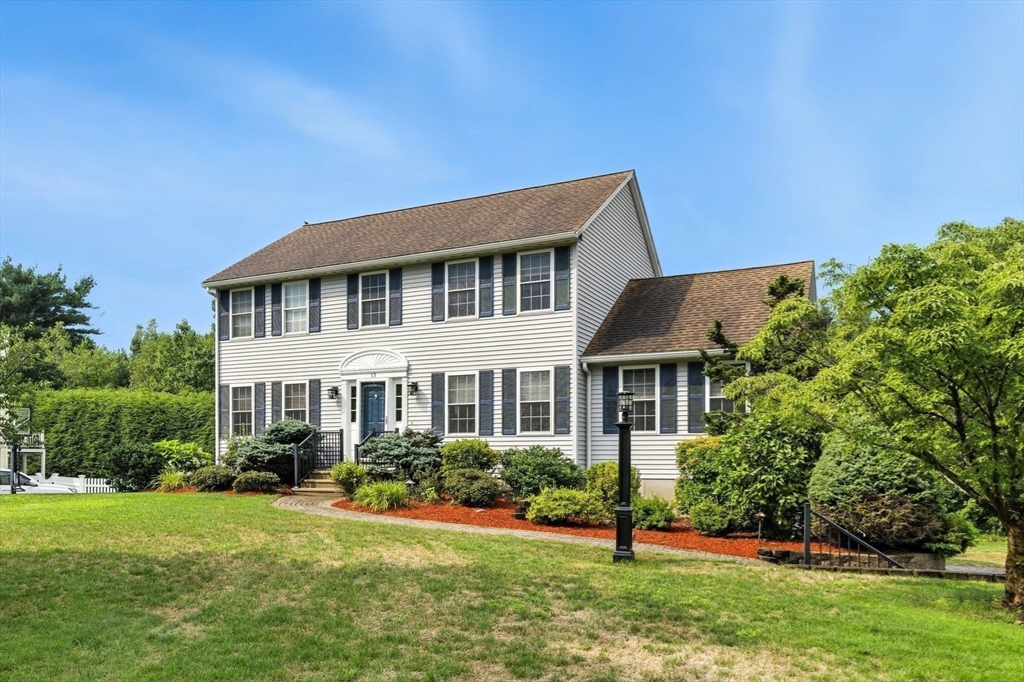 13 Colonial Drive Clinton, MA 01510 - Photo 38 of 42 a front view of a house with a yard