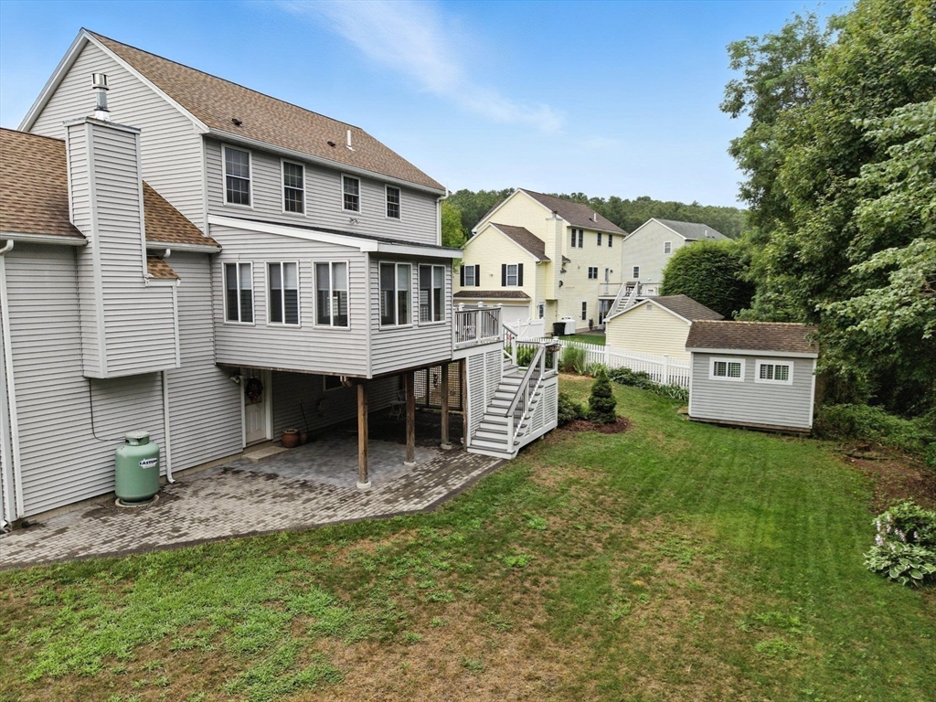 13 Colonial Drive Clinton, MA 01510 - Photo 4 of 42 a view of a house with a yard and sitting area