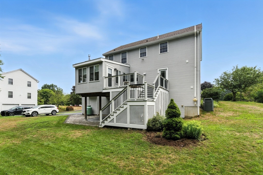 13 Colonial Drive Clinton, MA 01510 - Photo 5 of 42 a front view of a house with a yard