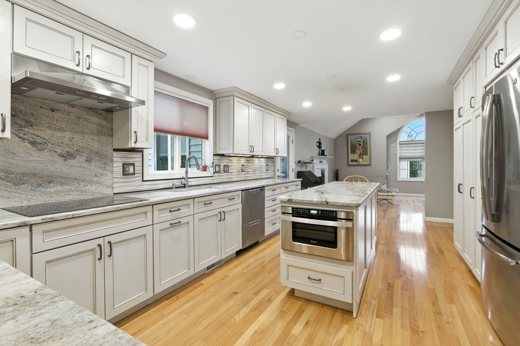 13 Colonial Drive Clinton, MA 01510 - Photo 10 of 42 a kitchen with a sink a counter top space stainless steel appliances and a window