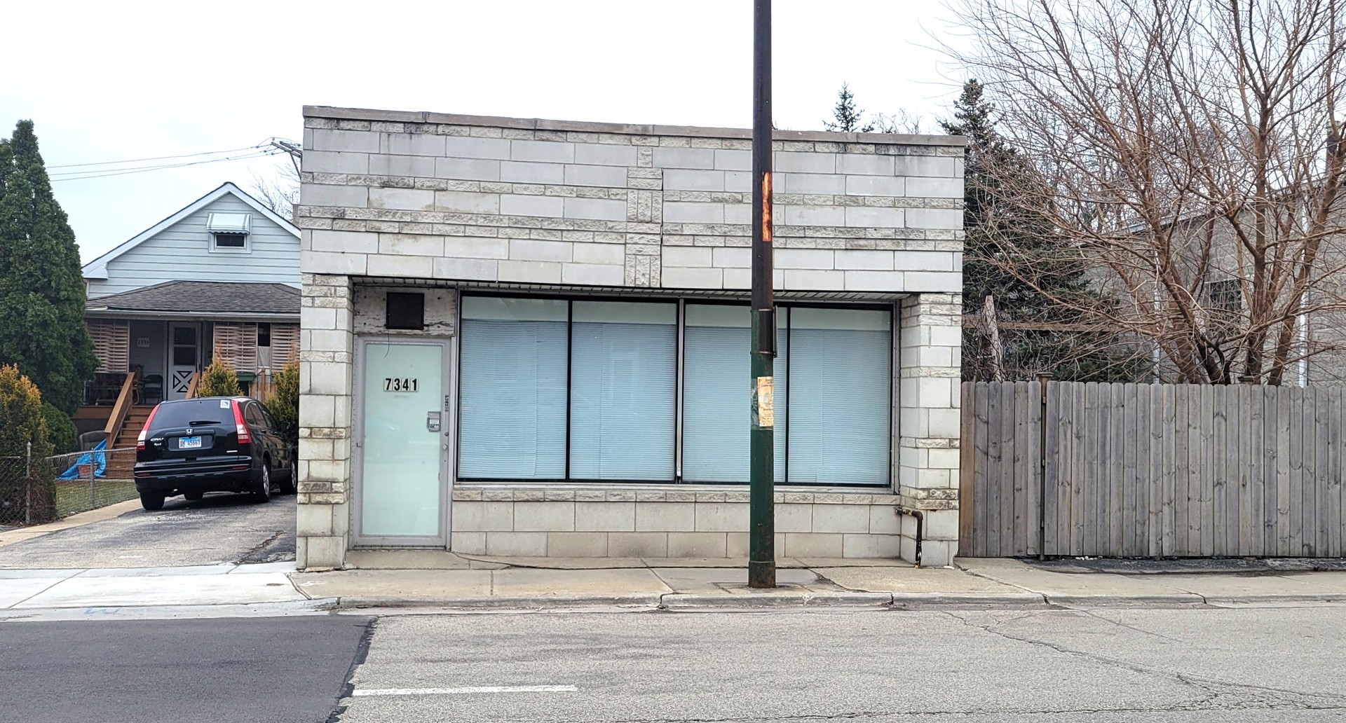 a view of a car park in front of a house