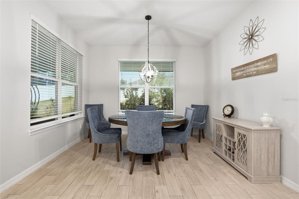 1271 Waterview Ridge Circle Apopka, FL 32703 - Photo 15 of 56 a view of a dining room with furniture window and outside view