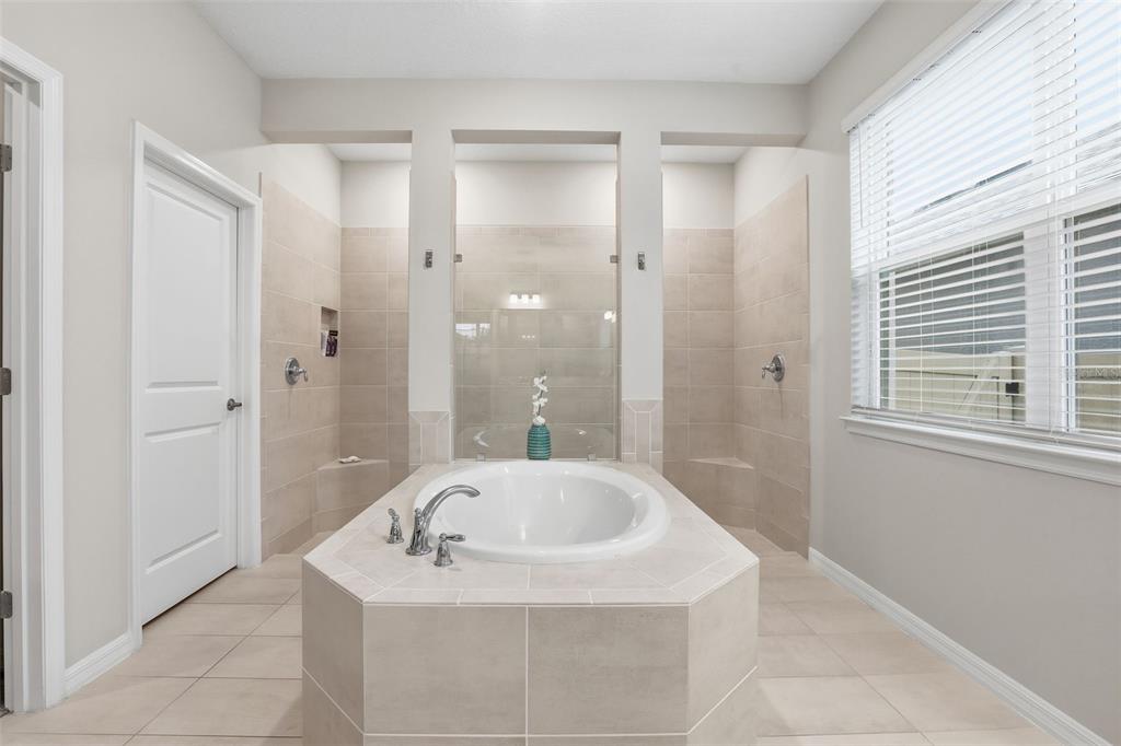 1271 Waterview Ridge Circle Apopka, FL 32703 - Photo 21 of 56 a bathroom with a sink a shower and a bathtub