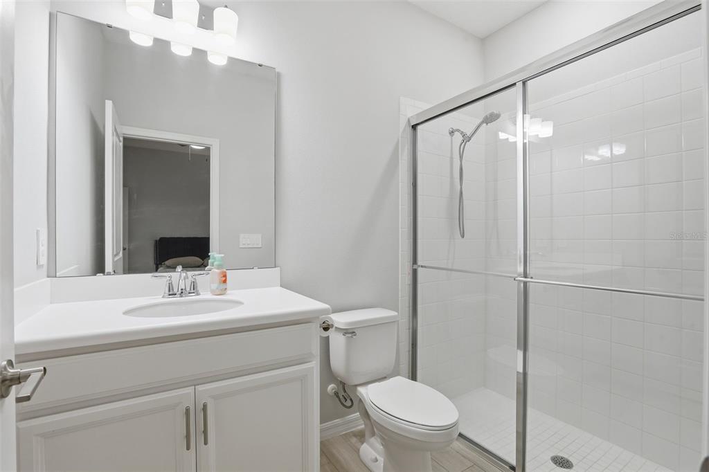 1271 Waterview Ridge Circle Apopka, FL 32703 - Photo 28 of 56 a bathroom with a sink toilet vanity and shower
