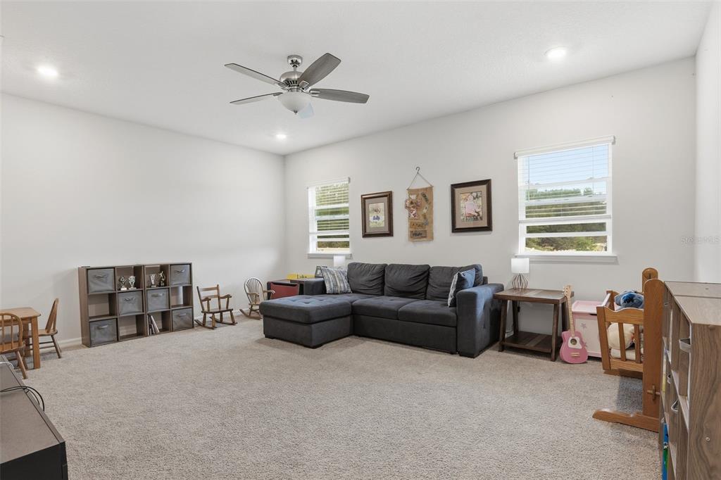 1271 Waterview Ridge Circle Apopka, FL 32703 - Photo 30 of 56 a living room with furniture and a window