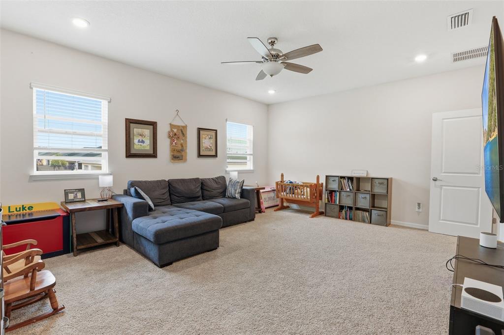 1271 Waterview Ridge Circle Apopka, FL 32703 - Photo 31 of 56 a living room with furniture and a window