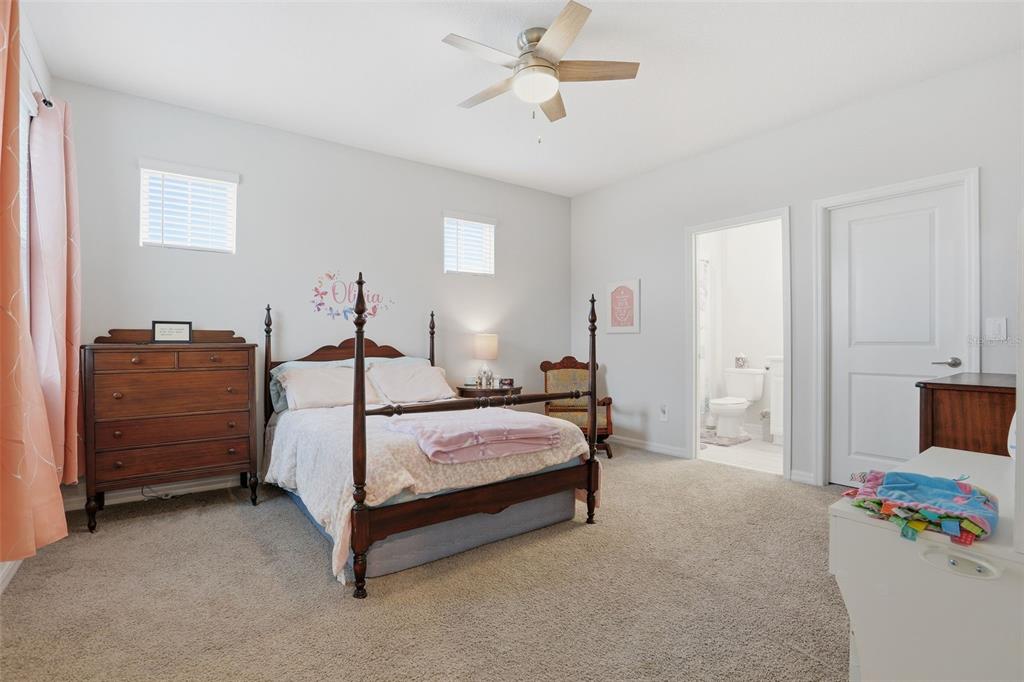 1271 Waterview Ridge Circle Apopka, FL 32703 - Photo 33 of 56 a bedroom with a bed and dresser