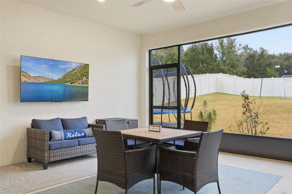 1271 Waterview Ridge Circle Apopka, FL 32703 - Photo 42 of 56 a living room with furniture and a large window