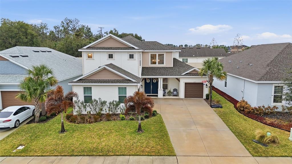 1271 Waterview Ridge Circle Apopka, FL 32703 - Photo 52 of 56 a view of house with garden and tall tress