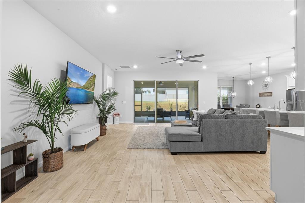 1271 Waterview Ridge Circle Apopka, FL 32703 - Photo 6 of 56 a living room with furniture and a large window