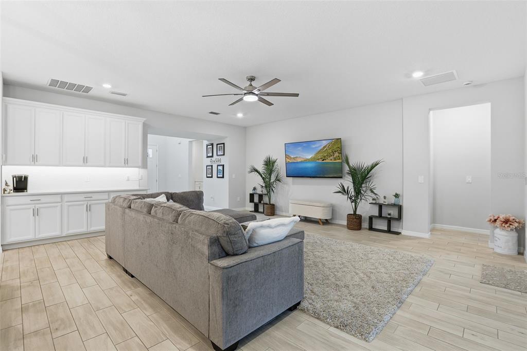 1271 Waterview Ridge Circle Apopka, FL 32703 - Photo 7 of 56 a living room with furniture and wooden floor