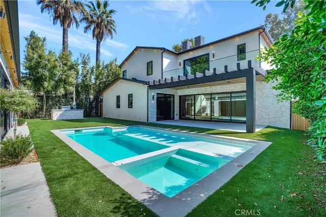 a view of swimming pool with a patio