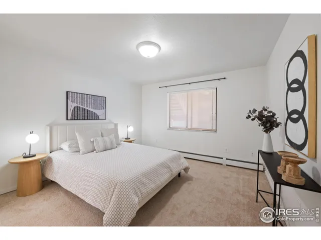 a bedroom with a bed and chair