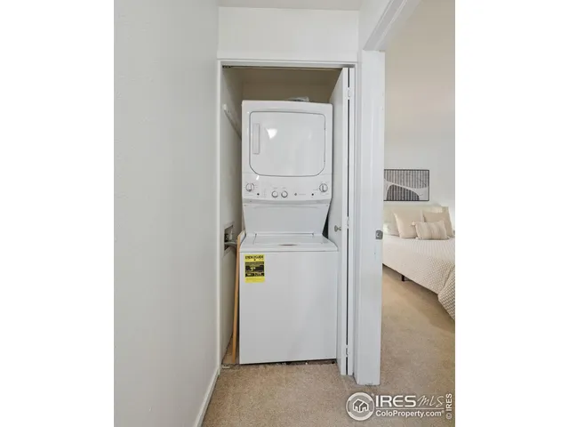 a view of hallway with bathroom