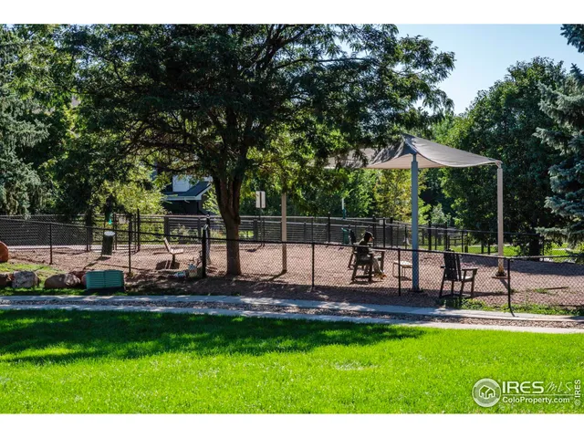 a view of a park with swings