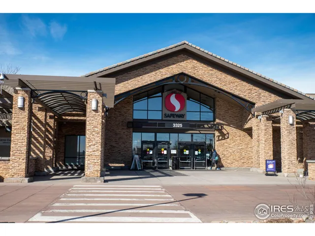 a view of a building with traffic signal lights