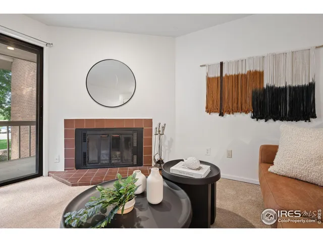 a view of a livingroom with furniture and a fireplace