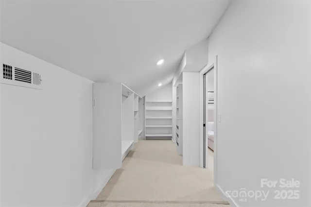 a view of entryway with stairs and a hallway