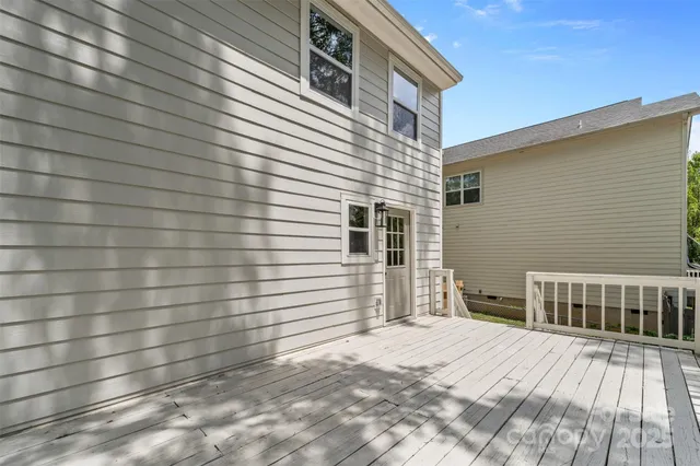 a view of a backyard with sitting area