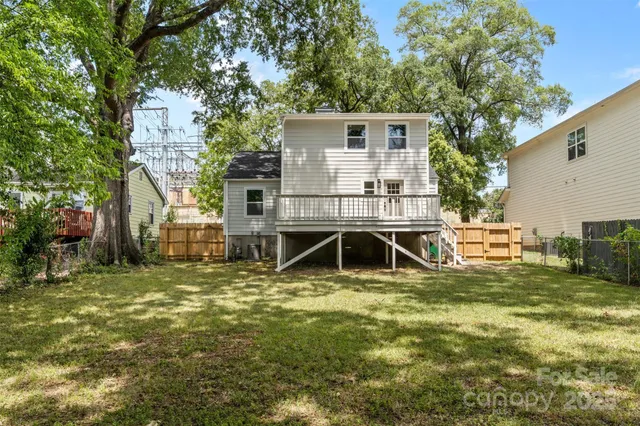 a view of outdoor space with garden and trees