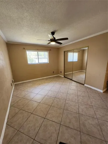 a view of an empty room with windows