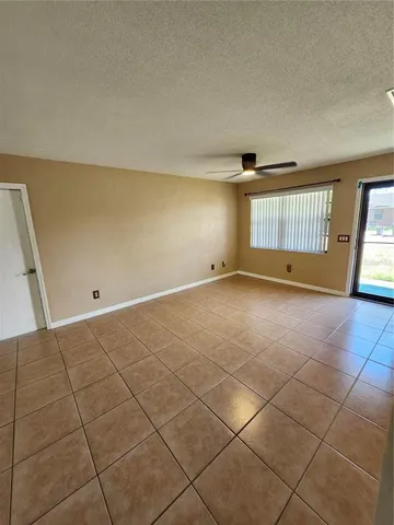 a kitchen with granite countertop a stove top oven sink and cabinets
