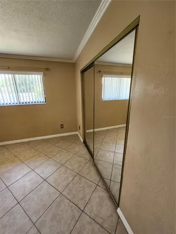 a view of a hallway with windows