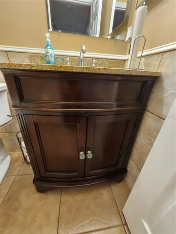 a bathroom with a toilet and bathtub