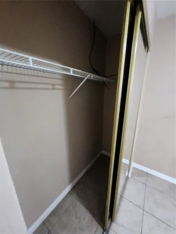 a kitchen with stainless steel appliances granite countertop a stove top oven a sink dishwasher and a refrigerator