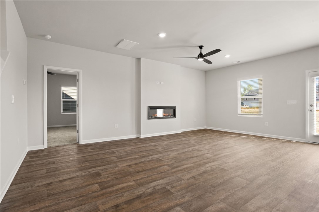629 Silver Fir Street Piedmont, SC 29673 - Photo 11 of 36 This bright living space features durable flooring and a modern fireplace, perfect for relaxation.