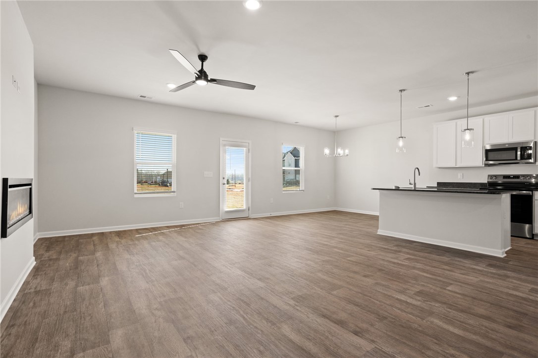 629 Silver Fir Street Piedmont, SC 29673 - Photo 12 of 36 This bright, open concept living area seamlessly connects to the kitchen, perfect for modern living.