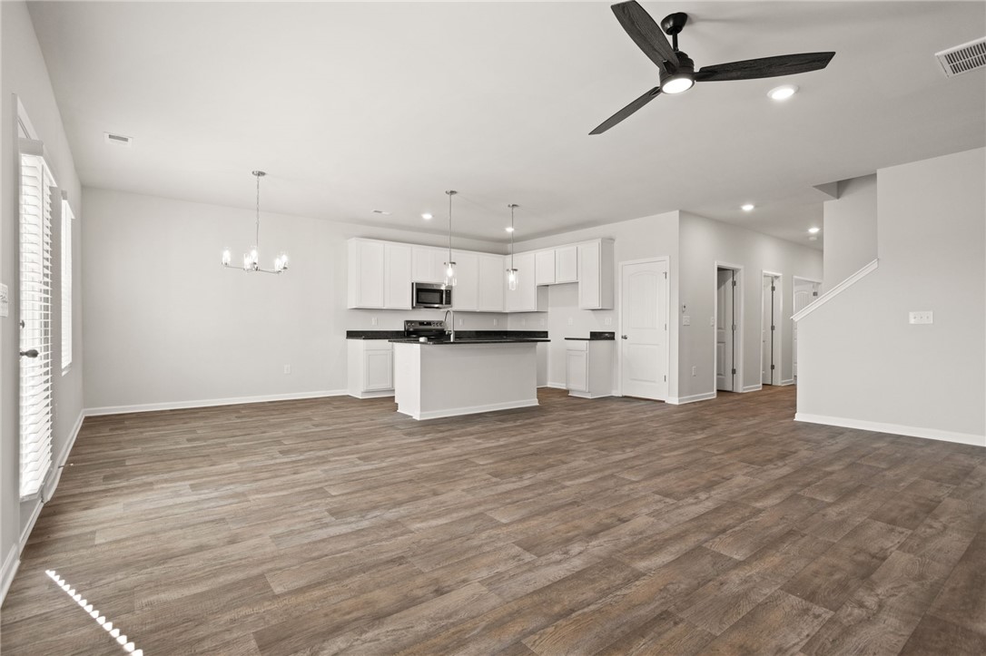 629 Silver Fir Street Piedmont, SC 29673 - Photo 13 of 36 This bright, open-concept living space features a functional kitchen, perfect for everyday living.