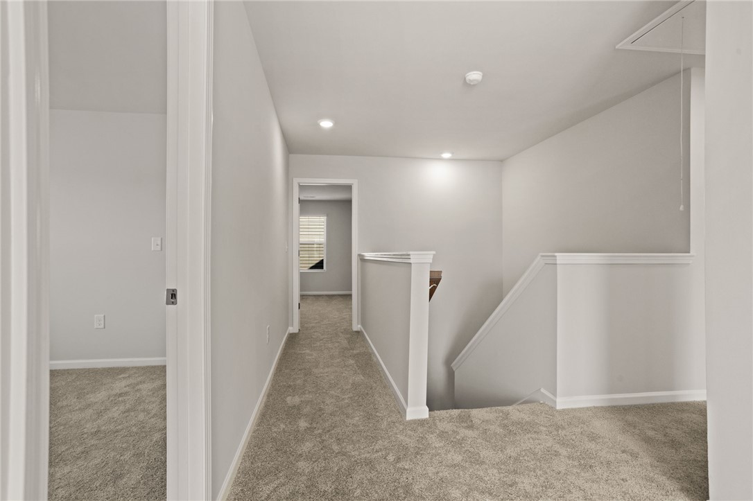 629 Silver Fir Street Piedmont, SC 29673 - Photo 24 of 36 This interior hallway offers convenient access to various rooms, bathed in natural light.