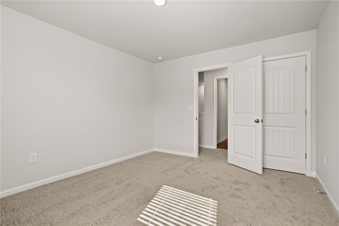 629 Silver Fir Street Piedmont, SC 29673 - Photo 28 of 36 This spacious room features neutral tones and soft carpeting, creating a tranquil retreat.