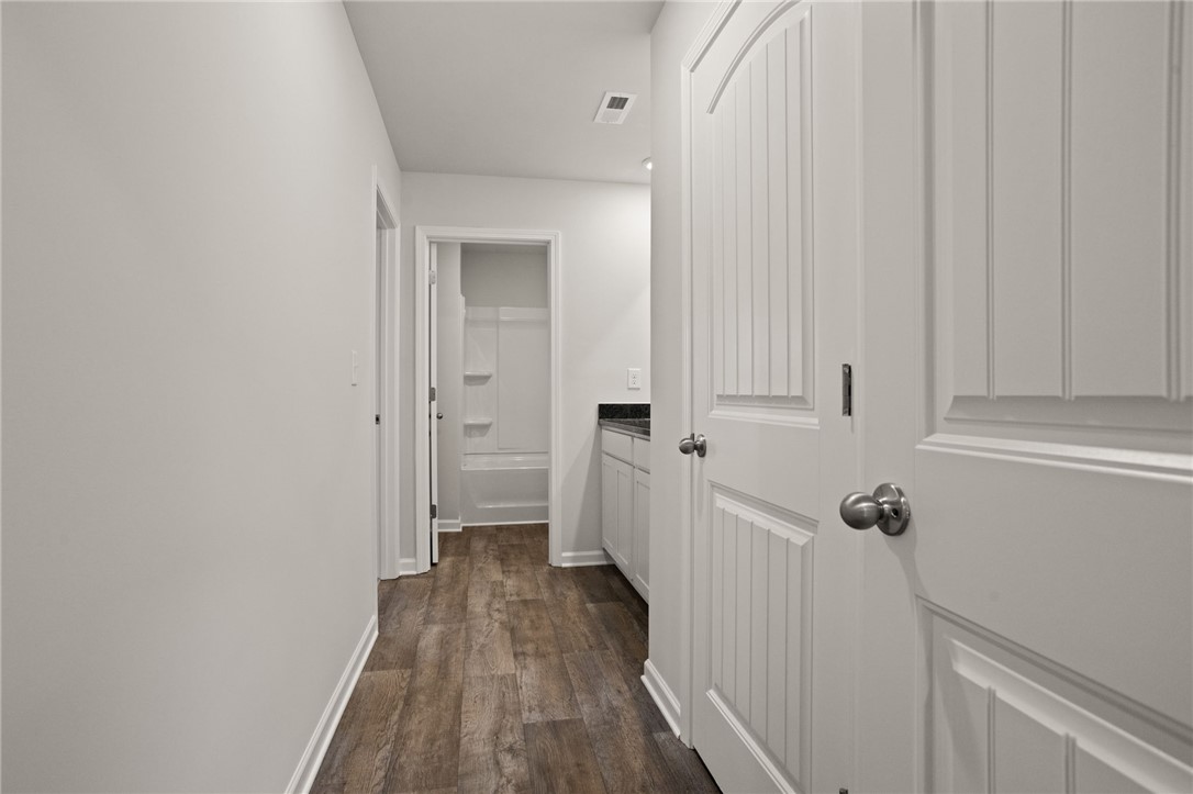 629 Silver Fir Street Piedmont, SC 29673 - Photo 29 of 36 This home features rich wood flooring, complementing white panel doors and bright, inviting walls.