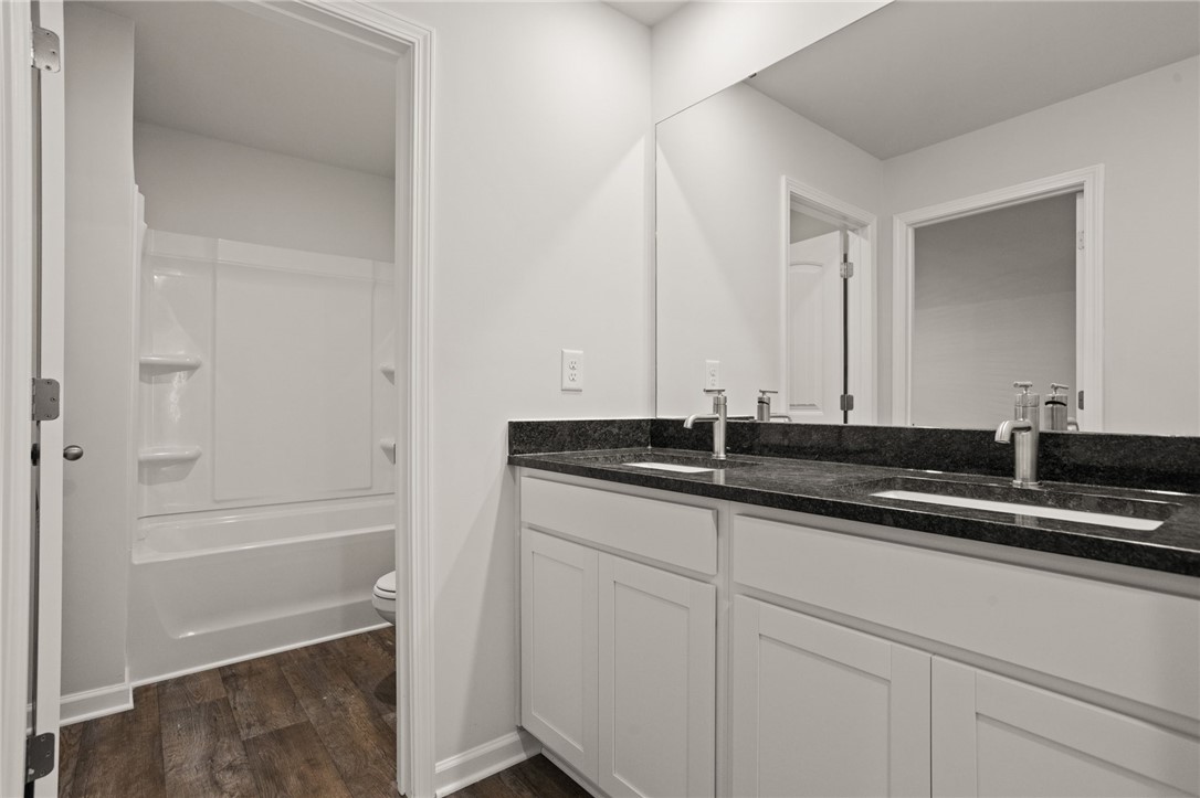 629 Silver Fir Street Piedmont, SC 29673 - Photo 30 of 36 This clean and bright bathroom offers a dual vanity with ample counter space and a convenient tub/shower combo.