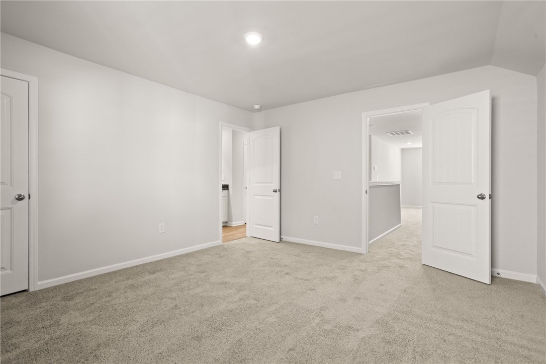 629 Silver Fir Street Piedmont, SC 29673 - Photo 32 of 36 This spacious room features neutral tones and soft carpeting, creating a tranquil and adaptable living space.