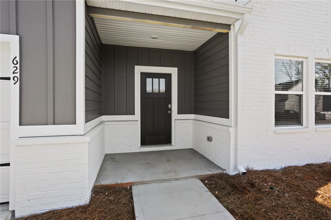 629 Silver Fir Street Piedmont, SC 29673 - Photo 4 of 36 This inviting entrance features a covered porch, offering a welcoming first impression.