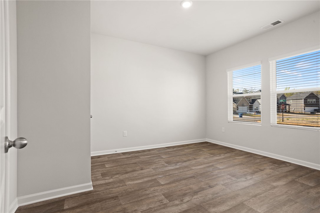 629 Silver Fir Street Piedmont, SC 29673 - Photo 6 of 36 This bright and airy room features durable flooring and ample natural light, creating a welcoming atmosphere.